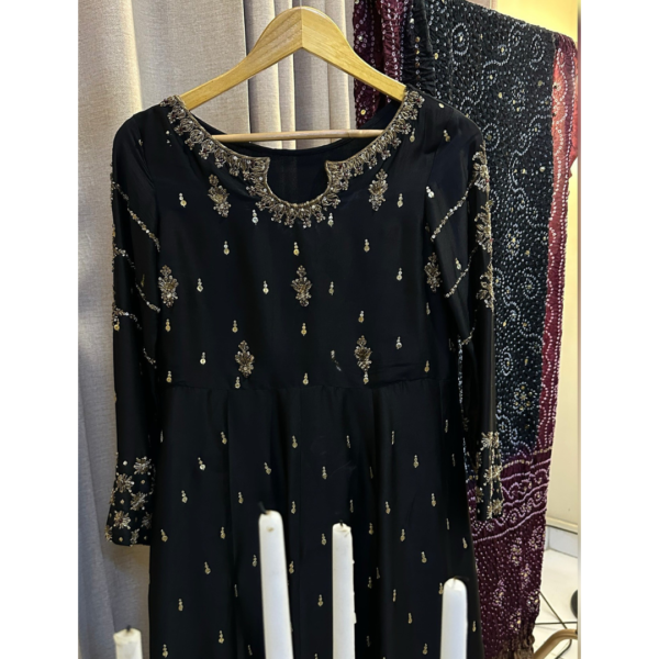 Black embellished kalidaar dress with maroon kaamdani dupatta styled for Eid evening