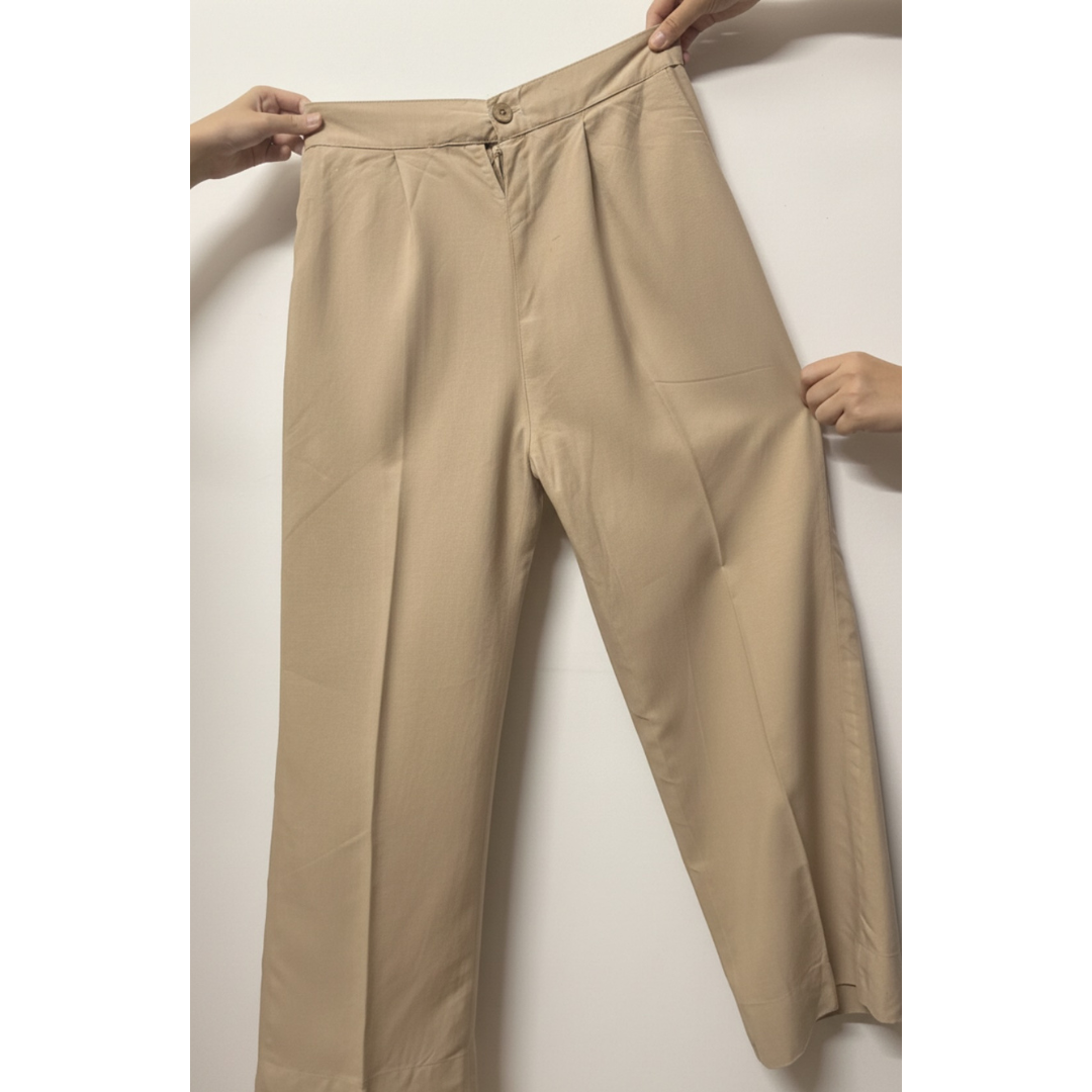 Beige cotton wide-leg pants showing leg width and structure