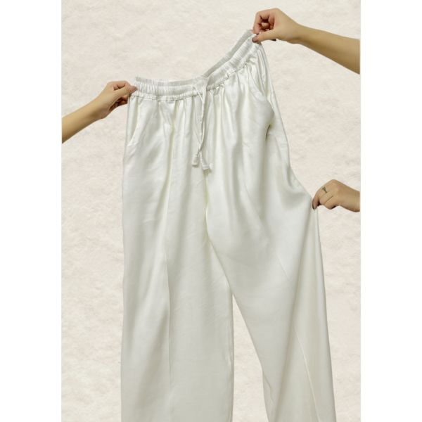 Ivory wide-leg linen pants full length view on Silhouette by SL