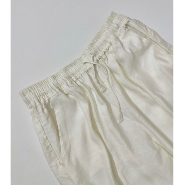Ivory linen wide-leg pants with elastic waistband and drawstring