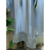 Floral embroidered hemline of Opal Elise pastel blue sheesha silk kaftan on Silhouette by SL