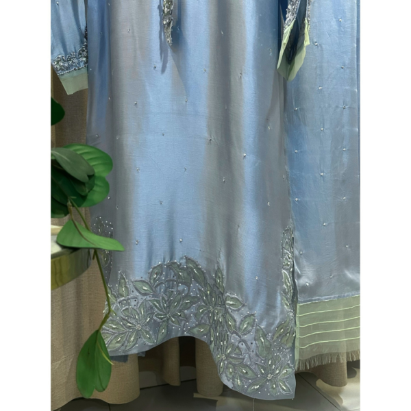 Floral embroidered hemline of Opal Elise pastel blue sheesha silk kaftan on Silhouette by SL